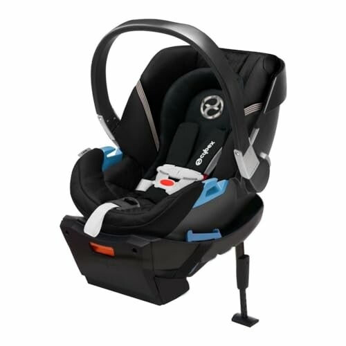 Black infant car seat with safety harness and base